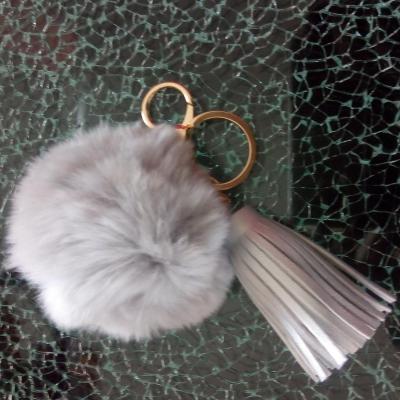 Porte-clé, bijou de sac pompon gris et pompon cuir